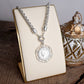 Heirloom Reverie – Ornate Coin Pendant Necklace: Worn Silver Tone