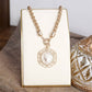 Heirloom Reverie – Ornate Coin Pendant Necklace: Worn Silver Tone
