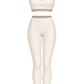 Watercolor cutout of cream and taupe top and leggings together